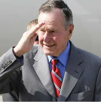  ?? PORNCHAI KITTIWONGS­AKUL/AFP/GETTY IMAGES ?? Former President George H.W. Bush, pictured in 2006, served in World War II.