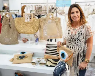  ??  ?? Muriel Zerdoun, one of the designers and founders of the Miami-based company, with a few pieces.