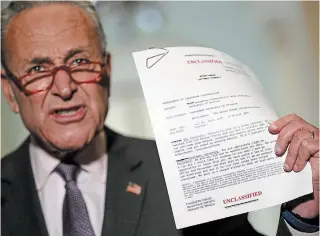  ?? JACQUELYN MARTIN THE ASSOCIATED PRESS ?? U.S. Senate Minority Leader Chuck Schumer of New York holds up a copy of a released transcript of a phone call between President Donald Trump and the President of Ukraine.