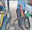  ?? ?? Consumers from Delhi gain ₹8.07 on every litre of petrol they fill in Gurugram and ₹8.46 per litre in Noida. AFP