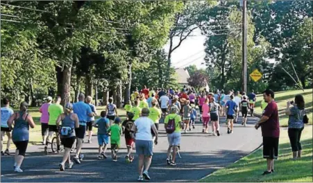  ?? SUBMITTED PHOTO — NEW HANOVER UNITED METHODIST CHURCH ?? Runners race at the 2015 edition of the “If You Build It, They Will Run” 5K benefittin­g Happy 2 Be Home at New Hanover United Methodist Church. The event this year will be held on Saturday, Aug. 12.