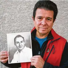 ?? Tania and Reuben Ortiz via Associated Press ?? Reuben Ortiz holds photo of the Rev. Jerome Coyle in Albuquerqu­e, N.M. Ortiz says he was angered to learn that Coyle, who had been living at his home, was a serial abuser.