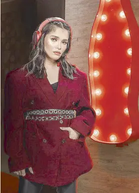  ??  ?? For the finale of Coke Studio season 2, KZ Tandingan captures the soulful and complex journey of each Filipino proving their worth to the world.