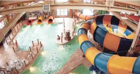  ?? THE OKLAHOMAN FILE ?? The Coyote Cannon water slide winds its way through part of the indoor water park at Great Wolf Lodge in Grapevine, Texas.