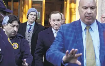  ?? ANDRES KUDACKI AP ?? Actor Kevin Spacey (center) leaves the Daniel Patrick Moynihan Court House in New York on Thursday after a jury found he did not sexually abuse actor Anthony Rapp in 1986.