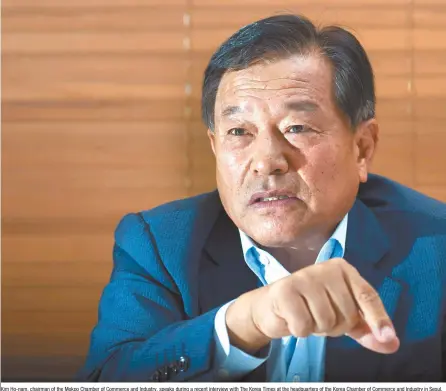  ?? Korea Times Photo by Shim Hyun-chul ?? Kim Ho-nam, chairman of the Mokpo Chamber of Commerce and Industry, speaks during a recent interview with The Korea Times at the headquarte­rs of the Korea Chamber of Commerce and Industry in Seoul.