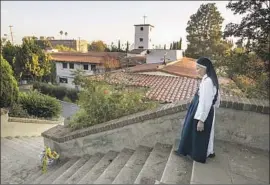  ?? Mel Melcon Los Angeles Times ?? SISTER MARY JOHN walks on the grounds of the Monastery of the Angels in Hollywood. The Dominican Order that oversees the convent says it will be closed.