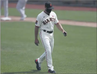  ?? NHAT V. MEYER — BAY AREA NEWS GROUP ?? San Francisco Giants manager Gabe Kapler heads off the field after making a pitching change against the Oakland A’s in the fifth inning at Oracle Park on Sunday.