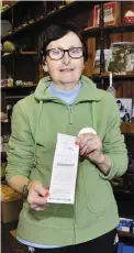  ?? Photos: Niall Duffy ?? Clockwise from above: postmistre­ss Mary Murphy with a copy of the €500,000 winning ticket; Helen Riddell and Bernie Orpen from the Bere Island Developmen­t Office; Colm Harrington from Bere Island Ferries; Bere Island postman Brendan Murphy.