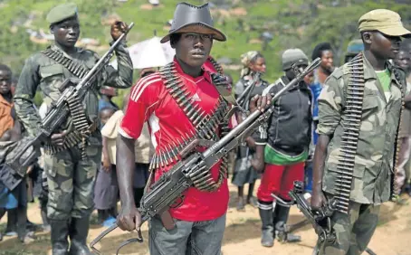  ?? Pictures: JAMES OATWAY ?? NEW RECRUITS: Rebel soldiers from the FPC during a passing-out ceremony at their stronghold in North Kivu in the Congo