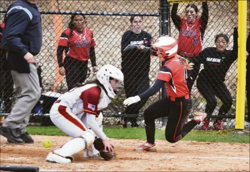  ?? Brian A. Pounds / Hearst Connecticu­t Media ?? Masuk’s Sarah Falcone scores on a squeeze bunt as the throw gets by St. Joseph catcher Kelsea Flanagan to put the Panthers ahead 2-1 in the 6th inning on Thursday in Trumbull.