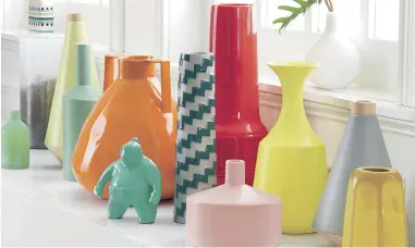  ?? PICTURE: CB2 ?? ATTRACTIVE: Group colourful sculptural vases of varying sizes on a bookcase, windowsill or table.