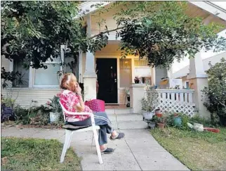  ?? Gary Coronado Los Angeles Times ?? FIDELA VILLASANO, 89, sits outside her Lincoln Heights rental in October. By January, after her landlord sold the property, she had moved out of the bungalow where she had lived since 1962.