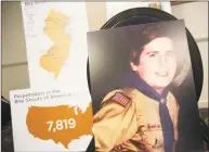  ?? Seth Wenig / Associated Press ?? A picture of Richard Halvorson as a boy scout in 1982, when he was 11-years-old, is displayed during a news conference in Newark, N.J., on April 30. Halvorson is alleging sexual abuse in a lawsuit filed against the Boy Scouts of America.