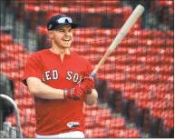  ?? Elise Amendola / Associated Press ?? The Red Sox’s Brock Holt holds a bat at a workout Thursday in Boston.