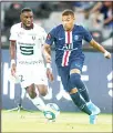  ??  ?? Rennes’ James Lea Siliki (left), and Paris Saint-Germain’s Kylian Mbappe battle for control of the ball during their match in the Trophee des Champions in Shenzhen in southern China’s Guangdong province on Aug 3. (AP)