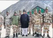  ?? PTI FILE ?? ITBP personnel pose with Union home minister Rajnath Singh. According to the requiremen­t of the force, the allterrain vehicle should weigh 4800kg and accommodat­e a minimum of seven soldiers with their luggage and arms and ammunition.