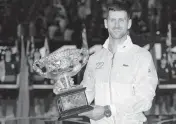  ?? AARON FAVILA AP ?? Novak Djokovic holds the trophy after defeating Stefanos Tsitsipas 6-3, 7-6 (7-4), 7-6 (7-5) in the Australian Open final.
