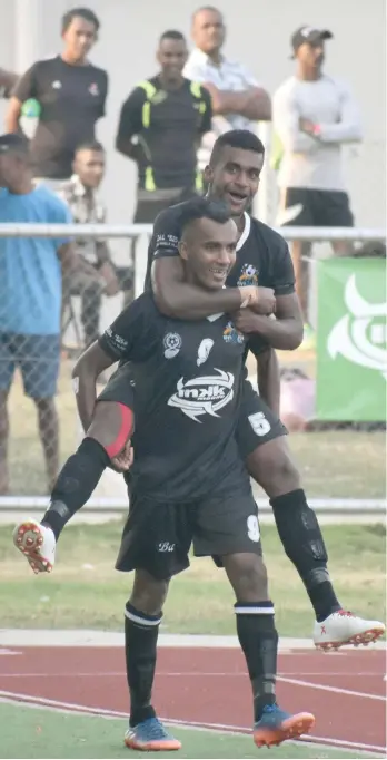  ?? Photo: Waisea Nasokia ?? Ba strikers Abbu Zahid carries Samuela Nabenia after scoring their second goal against Suva in the Inkk Mobile Battle of the Giants final at Churchill Park, Lautoka on July 29, 2018. Zahid scored Ba’s first goal as they won 2-0.