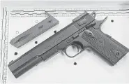  ?? MARK DUNCAN/The Associated Press ?? This fake handgun taken from 12-year-old Tamir Rice, who
was fatally shot by Cleveland police in November. Rice reportedly pulled the Colt 1911 replica on arriving officers.