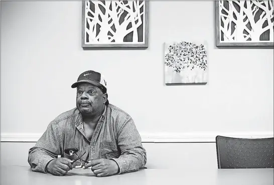  ?? [FRED SQUILLANTE/DISPATCH] ?? Cleophas Alexander discusses the difficulty of finding affordable housing while at IMPACT Community Action, where he has taken job-training and computer classes. He says many places he has looked at to rent would take more than half of his monthly...