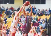  ?? GARY MIDDENDORF/DAILY SOUTHTOWN ?? Mother McAuley’s Bella Finnegan, left, blocks a shot by Montini’s Taylor Charles during Thursday’s game.