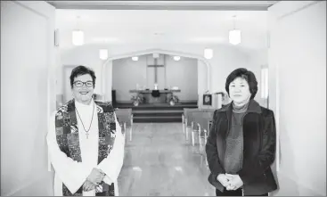  ?? Herald photo by Tijana Martin ?? New pastor Eva Stanley, left, joins church council chair Sharon Tamura in rememberin­g the history of Japanese United as they celebrate 75 years as a congregati­on. @TMartinHer­ald