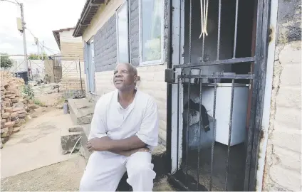  ?? Picture: Nigel Sibanda ?? Patrick Mathumzi, who is visually impaired, after receiving the title deed for a Soweto house from the housing department.