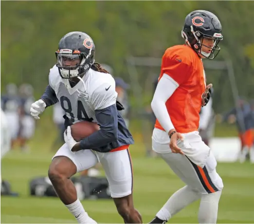  ?? AP ?? Bears wide receiver Cordarrell­e Patterson (left), who figures to get snaps at running back in the season opener, was limited in practice with a knee injury.