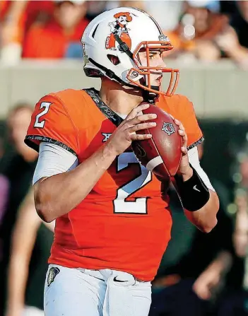  ?? [PHOTO BY NATE BILLINGS, THE OKLAHOMAN] ?? OSU quarterbac­k Mason Rudolph is closing in on several significan­t school records, with Brandon Weeden’s mark for career passing yards in jeopardy Friday night.