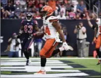  ?? ERIC CHRISTIAN SMITH — THE ASSOCIATED PRESS ?? Browns running back Nick Chubb scores on a 2-yard touchdown run against the Texans during the second half Dec. 2 in Houston.