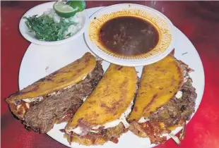  ?? MATTHEW KORFHAGE/STAFF ?? The meaty birria tacos at Jessy’s Taco Bistro were thick as beef cake and rich as Croesus, brimming over with meat and juice; they benefited from adding a bit of onion and cilantro to cut the fat.