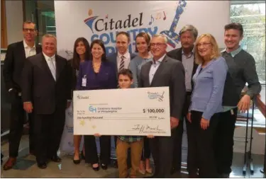  ?? DIGITAL FIRST MEDIA FILE PHOTO ?? Citadel recently made a $100,000 donation to Children’s Hospital of Philadelph­ia — from proceeds raised during the inaugural Citadel Country Spirit USA Music Festival. In this photo left to right are: Philip Faris, Citadel; Joe Glace, Citadel Board and CHOP; Francesca Cosmi, CHOP; Julia Wicoff, CHOP; Kevin McMahon, CHOP; Grayson Savery, CHOP patient; Jackie Savery; Jeff March, Citadel president &amp; CEO; Alan Jacoby, Impact Entertainm­ent; Susan Hamley, Chester County Conference &amp; Visitors Bureau; Drew Jacoby, Impact Entertainm­ent.