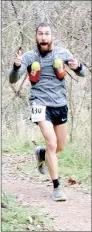  ?? Keith Bryant/The Weekly Vista ?? Mike Rush, proprietor of Rush Running, enters the last mile of his 40-mile trail run with no shortage of enthusiasm.