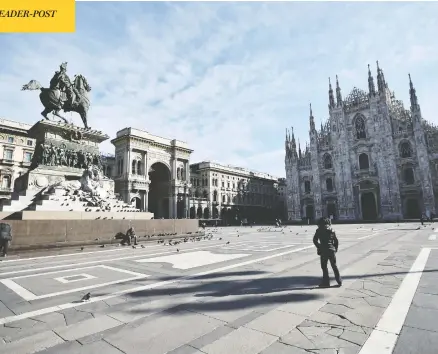  ?? FLAVIO LO SCALZO / REUTERS ?? A view of Duomo Square in Milan, Italy, on Sunday after the Italian government imposed a virtual lockdown on the country’s north.