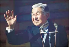  ?? (AP FOTO) ?? AGING AKIHITO. This Dec. 23, 2014 file photo shows Japan’s Emperor Akihito waving to well-wishers as he and family members appear on the balcony of the Imperial Palace during the emperor’s 81th birthday in Tokyo.