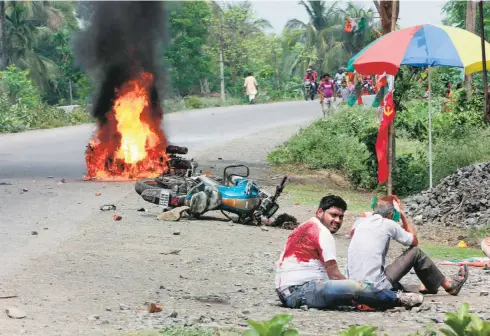  ??  ?? VEHICLES SET ON FIRE and people injured in the poll violence in Nadia district on election day.