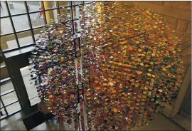  ?? SAL PIZARRO — BAY AREA NEWS GROUP ?? “Noisy Blushes,” a mesmerizin­g mobile by Los Angeles-based artist Pae White was commission­ed for the lobby of the San Jose Museum of Art, which reopened Friday.