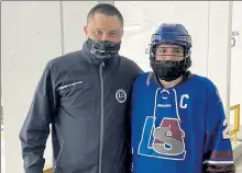  ?? NICK MALLARD / SENTINEL & ENTERPRISE ?? Lunenburg/Ayer Shirley head coach Eric Short and senior Nathan Handy each reached milestones Saturday night against Leominster. Short won his 200th career game, while Handy notched his 100th career point.