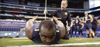  ?? CANADIAN PRESS FILE PHOTO ?? Mississipp­i State offensive lineman Justin Senior is measured for flexibilit­y at the National Football League’s scouting combine in Indianapol­is on March 3. He tops the list of Canadians who could be NFL draft picks.