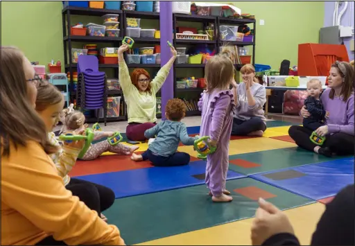  ?? PHOTOS BY LEXEY SWALL — THE NEW YORK TIMES ?? Business owner Tiffany Cianci, center background, leads a class at Teeter Tots Music n Motion in Frederick, Md., on Dec. 13. Cianci is fighting a court battle against Unleashed Brands, which bought the company that originally franchised her business.