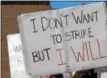  ?? ADAM FARENCE — DIGITAL FIRST MEDIA ?? A West Chester University professor holds a sign during a rally prior to the strike. The professors and other staff eventually went on strike.