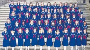  ?? CONTRIBUTE­D PHOTO ?? The original uniform of the Chattanoog­a Girls Choir was a royal blue sailor dress, as shown in this 1990 photo.