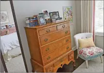  ??  ?? Homeowner Kate Breslin still has the antique furniture from her childhood bedroom, passed down to her from her parents. The dresser and bedside table are now in the bedroom of her 9-year-old daughter, Avery Breslin. Kate recovered the chair in five...