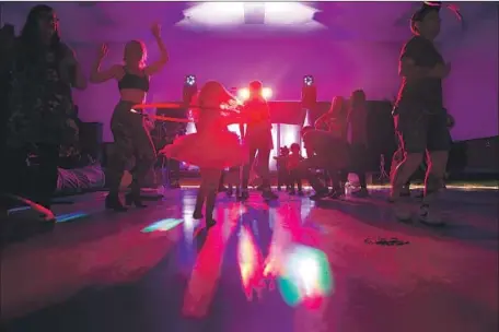  ?? Photograph­s by Christina House Los Angeles Times ?? PARENTS AND CHILDREN dance at Baby Rave, a magnet for families seeking affordable fun in the increasing­ly expensive Bay Area.