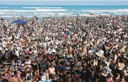  ?? Edward A. Ornelas / Staff file photo ?? Spring breakers party in 2016 on South Padre Island. A change in spring break dates this year may ease Texas Week crowds.