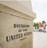  ?? DANIEL ACKER/BLOOMBERG NEWS ?? A boundary monument stands along the U.S.-Mexico border in Tijuana, Mexico. As many as 800 people are awaiting asylum hearings.