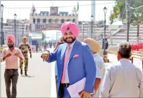  ?? IANS ?? Punjab minister Navjot Singh Sidhu leaves to attend the oath-taking ceremony of Pakistani Prime Minister Imran Khan via Attari border, in Punjab, on 17 August.