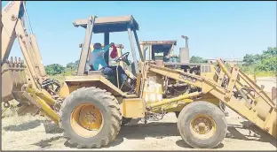  ?? ?? (INSET L) The 580D Case Backhoe, which was bought for BSA Training Centre. It went for E75 000, from a reserve price of E60 000.