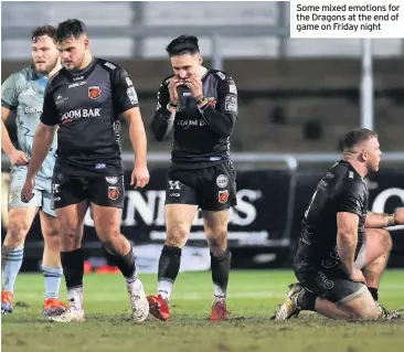  ??  ?? Some mixed emotions for the Dragons at the end of game on Friday night